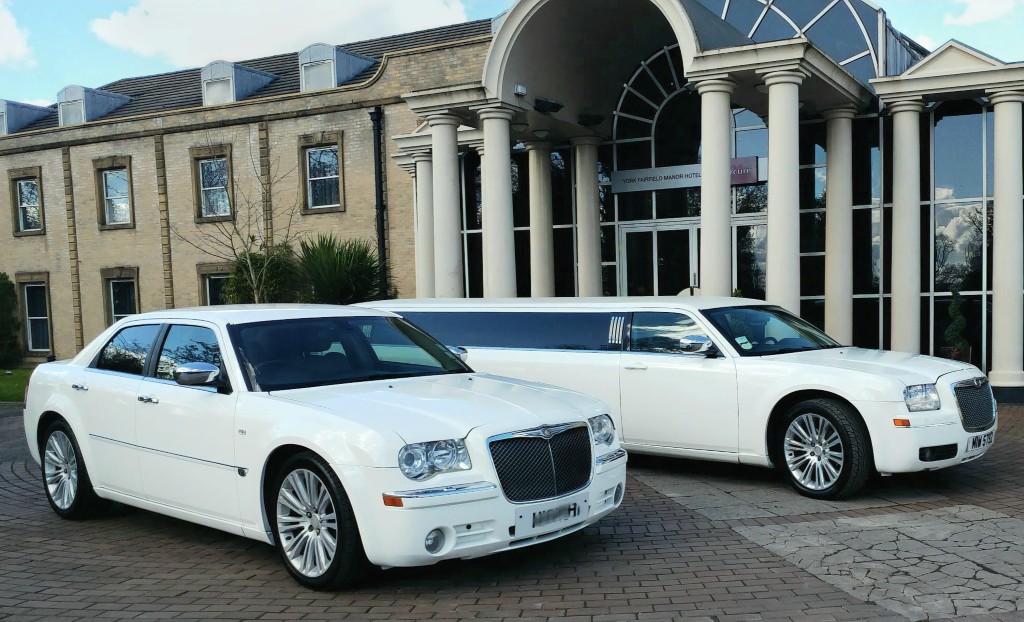 Luxurious Bentley bridal car and white stretch limo rental in front of mansion Luxurious Bentley bridal car and white stretch limo rental in front of mansion